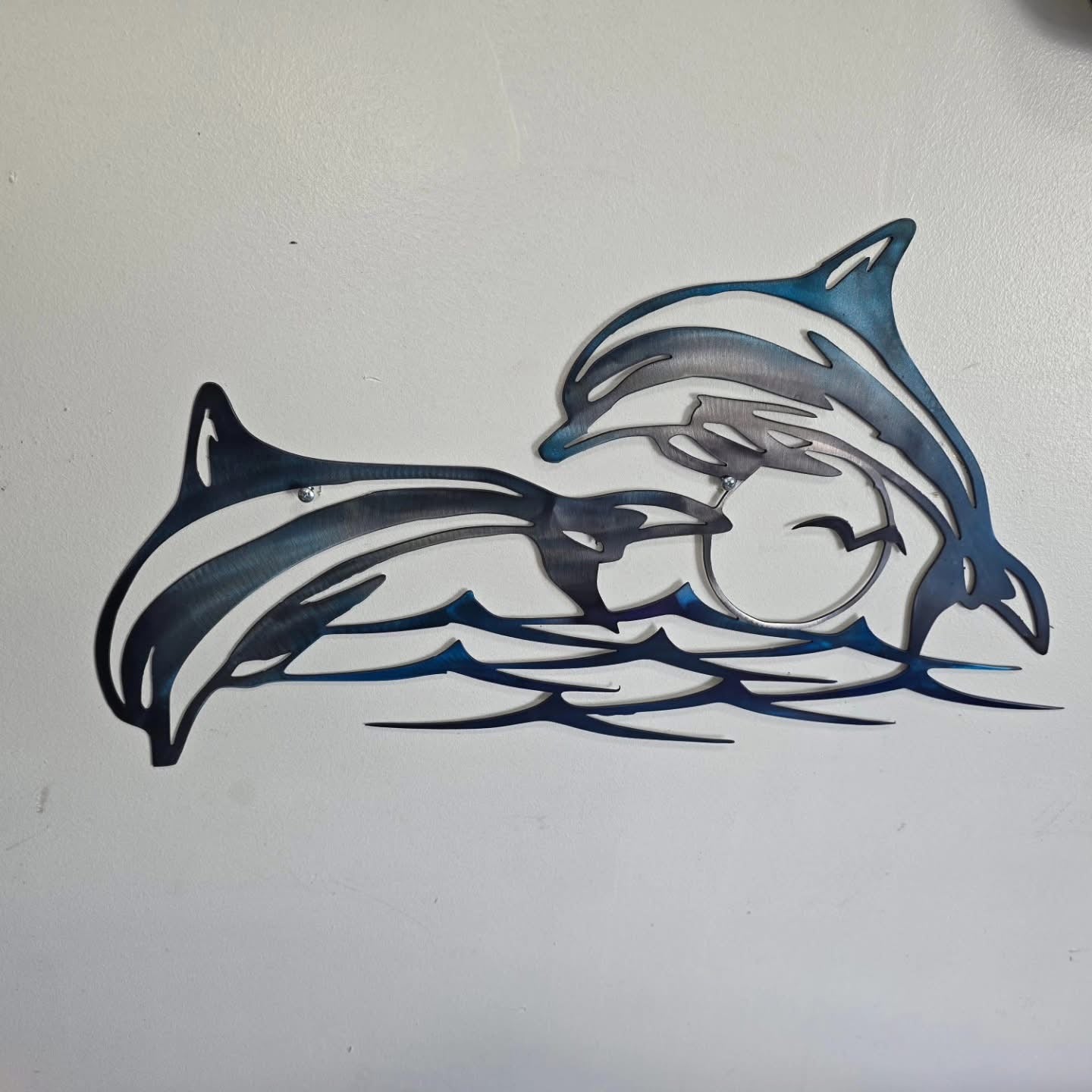 Dolphins Jumping over water